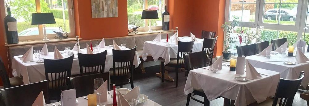 Tables set at Osteria Da Vino